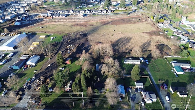 birds eye view of property with a residential view