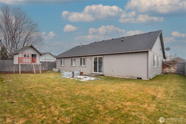 back of house featuring a fenced backyard, a lawn, and a patio