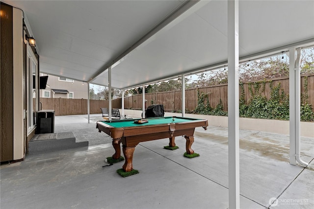 exterior space featuring billiards and concrete flooring