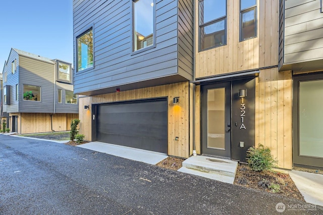 view of exterior entry with a garage