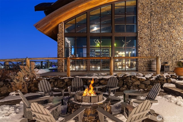 patio terrace at dusk with a fire pit