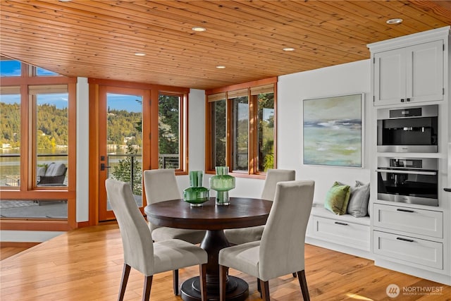 dining area with wood ceiling, light wood finished floors, and recessed lighting