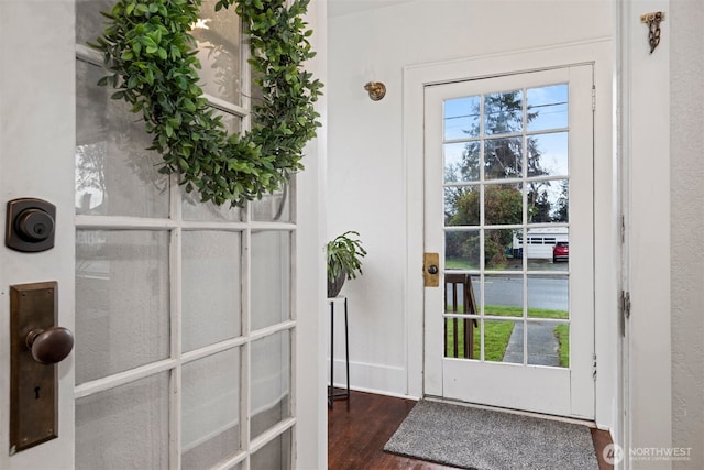 entryway with wood finished floors