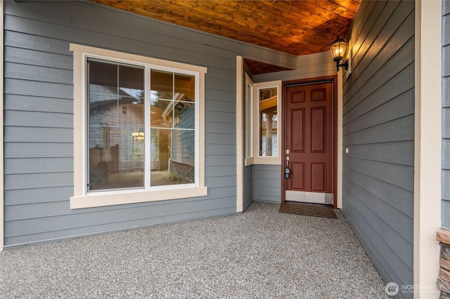 entrance to property featuring a porch