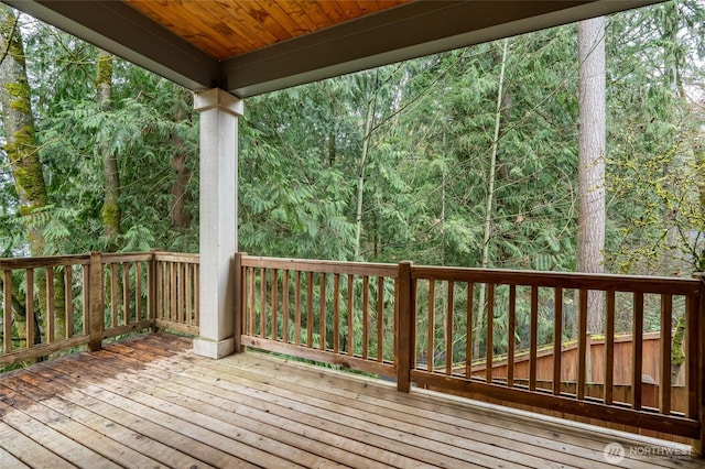 deck featuring a wooded view