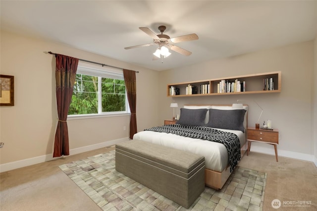 bedroom featuring light carpet, ceiling fan, and baseboards