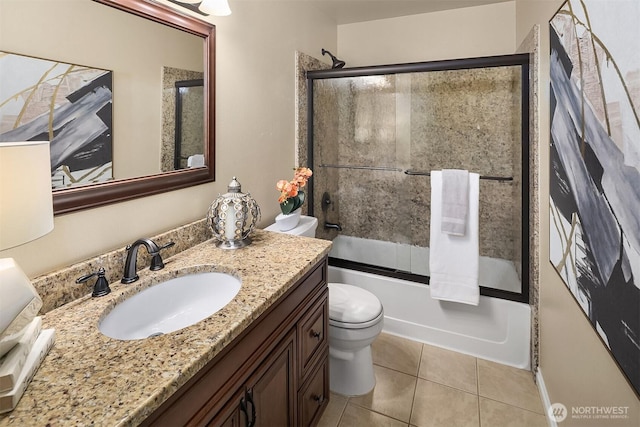 full bathroom with toilet, enclosed tub / shower combo, vanity, and tile patterned floors