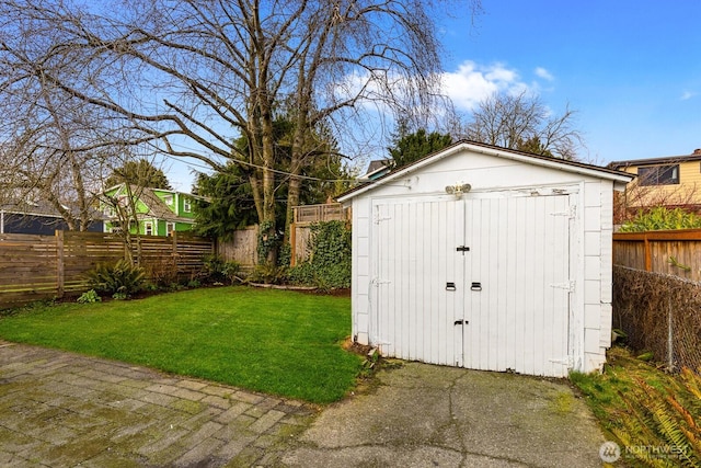 view of shed featuring a fenced backyard