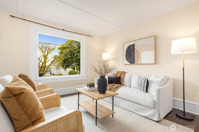 living room featuring wood finished floors and baseboards