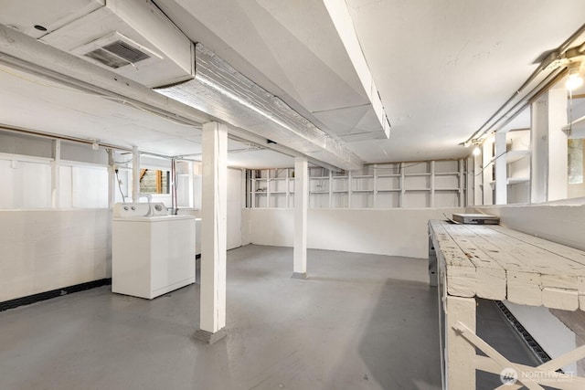 basement featuring visible vents and independent washer and dryer