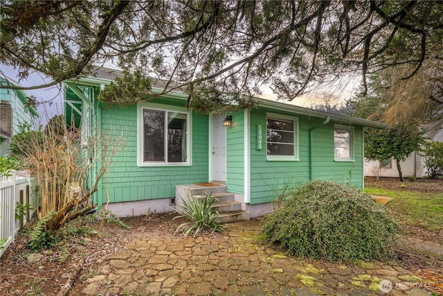 view of front of house with fence