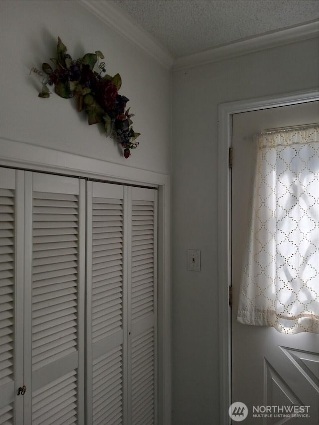 details with a textured ceiling and crown molding