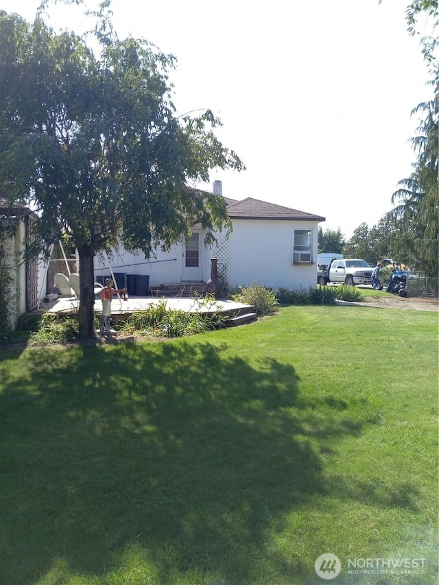 view of home's exterior featuring a yard, a patio, and stucco siding