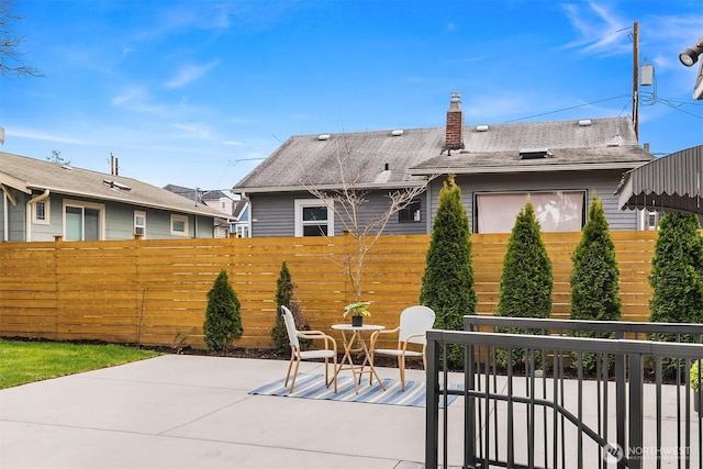 view of patio / terrace featuring fence