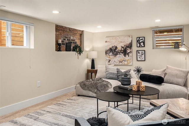 carpeted living area featuring visible vents, recessed lighting, and baseboards