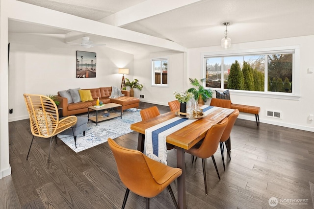 dining area featuring dark wood-style flooring, visible vents, and baseboards