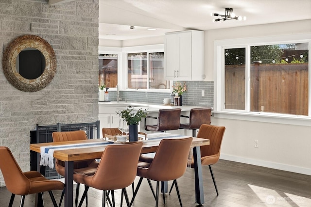 dining room with dark wood-style floors and baseboards