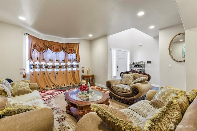 living area with recessed lighting and baseboards