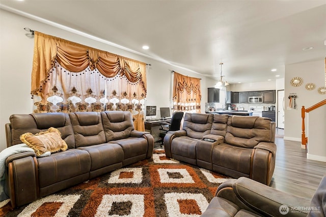 living room with baseboards, dark wood-style flooring, and recessed lighting