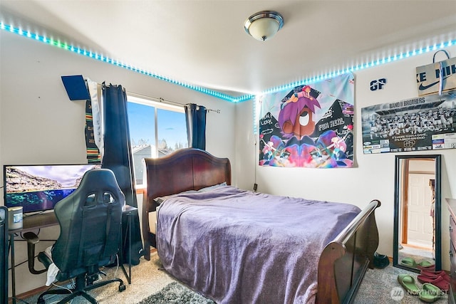 bedroom featuring light carpet