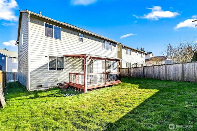 rear view of property featuring a fenced backyard, a lawn, a deck, and a pergola