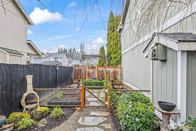 view of yard featuring a garden and fence