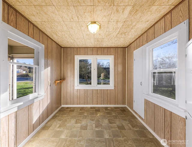 unfurnished sunroom featuring a wealth of natural light