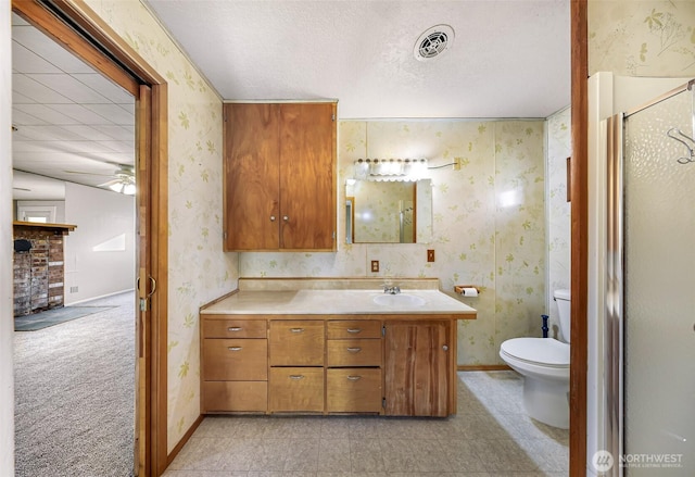 bathroom with wallpapered walls, baseboards, and visible vents