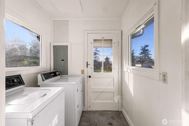 laundry room featuring laundry area, separate washer and dryer, and electric panel