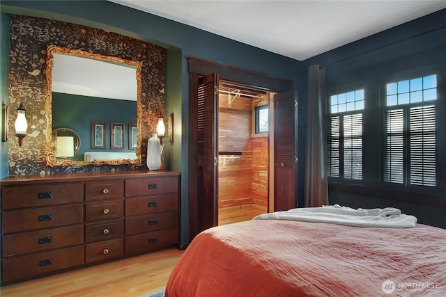 bedroom with light wood finished floors