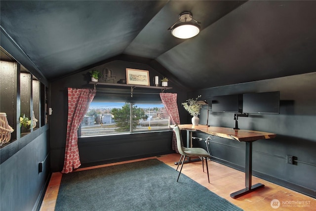 office area featuring lofted ceiling and wood finished floors