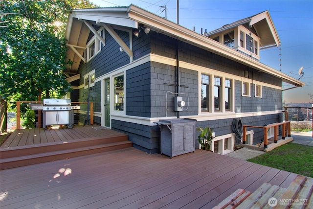 wooden terrace with grilling area