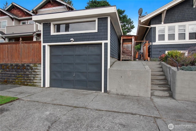 view of front of property featuring a garage and concrete driveway