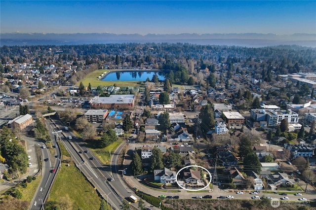 birds eye view of property featuring a water view