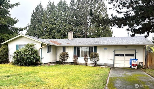 ranch-style home with a garage, crawl space, a chimney, and a front lawn