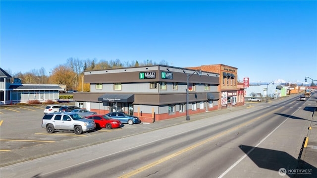 view of street with sidewalks and curbs