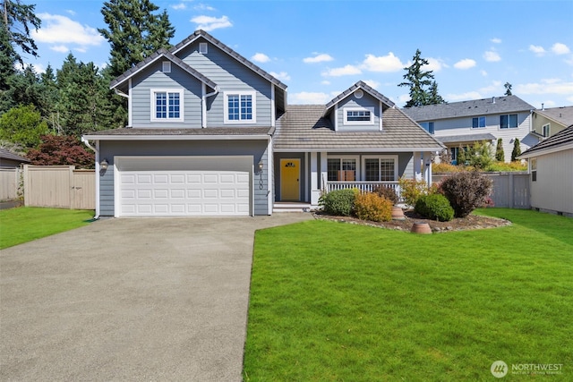 9100 Lewis Dr NE, Lacey, WA 98516 - traditional-style home with concrete driveway, a garage, and covered porch
