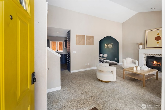9100 Lewis Dr NE, Lacey, WA 98516 - living room with carpet flooring, vaulted ceiling, a fireplace, arched walkways, and stairs