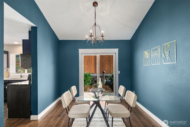9100 Lewis Dr NE, Lacey, WA 98516 - dining area with dark wood-style floors, a textured wall, and a chandelier