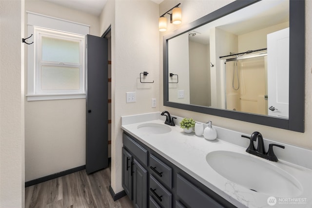 9100 Lewis Dr NE, Lacey, WA 98516 - bathroom with wood finished floors, double vanity, and a shower