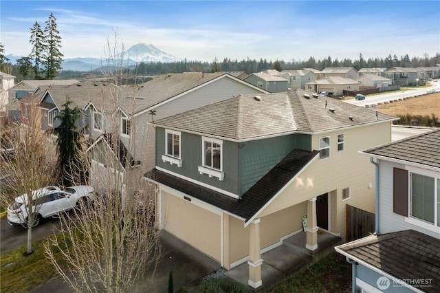 aerial view featuring a mountain view and a residential view