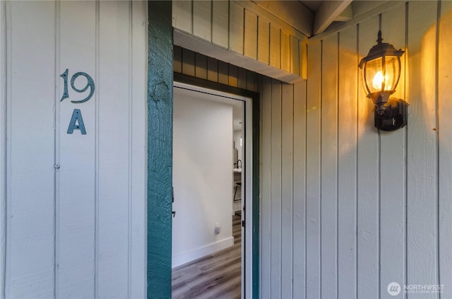 view of exterior entry with board and batten siding