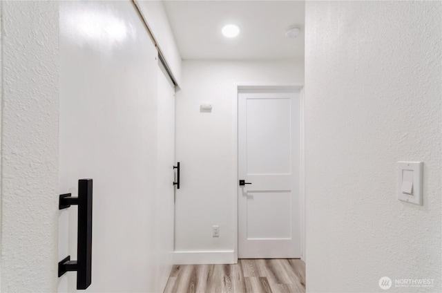 hallway with light wood-style flooring