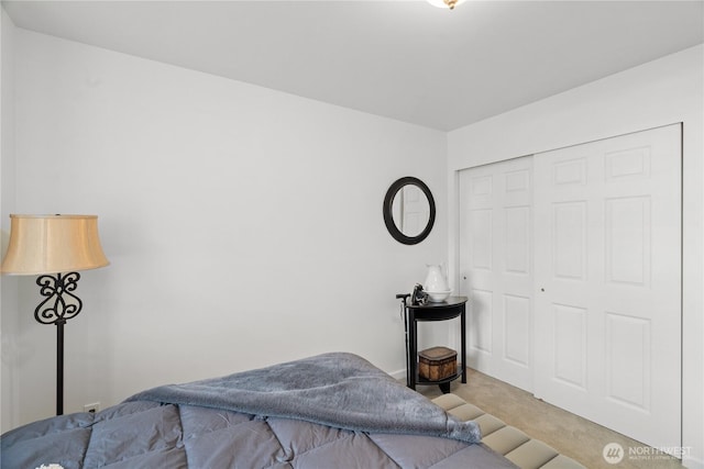 carpeted bedroom featuring a closet