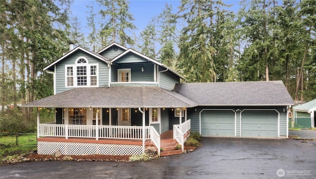 21406 92nd Ave E, Graham, WA 98338 - country-style home featuring a porch, a shingled roof, a garage, and driveway