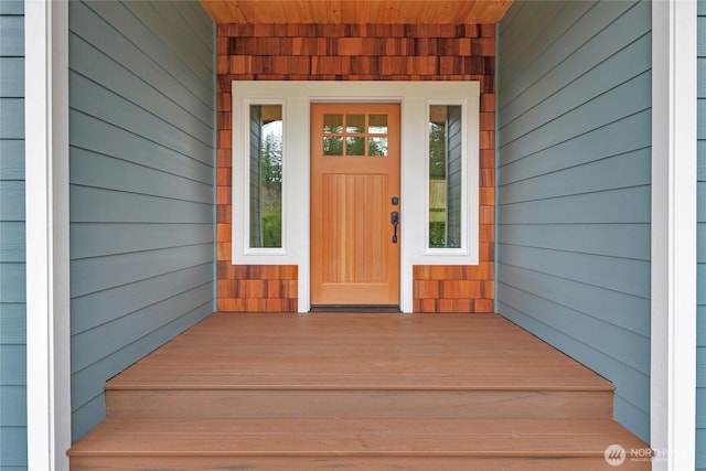 doorway to property with a porch