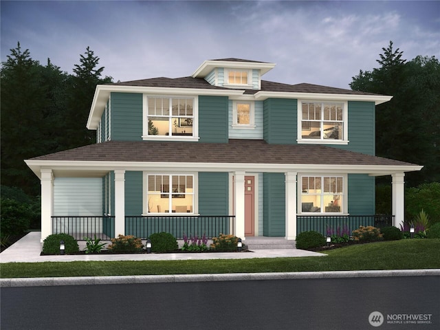 traditional style home featuring covered porch, a front lawn, and roof with shingles