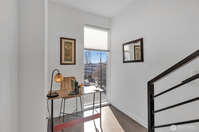 office space featuring wood finished floors and baseboards