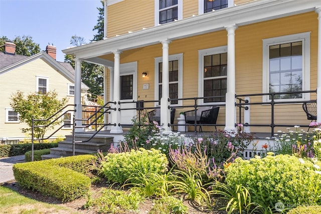 entrance to property featuring covered porch