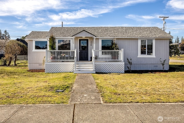 view of front of property with a shingled roof, crawl space, covered porch, and a front lawn